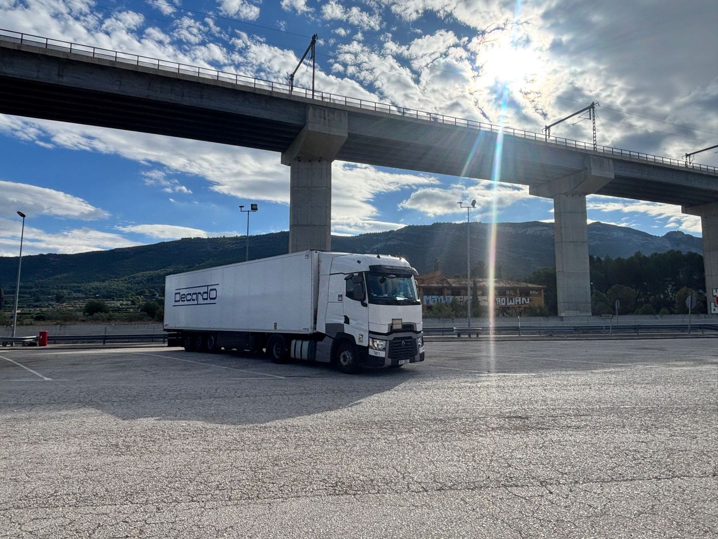 Decardo truck with a semi-trailer under a viaduct